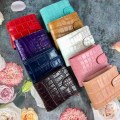Солидный мужской кошелек с монетницей и на хлястике из кожи крокодила